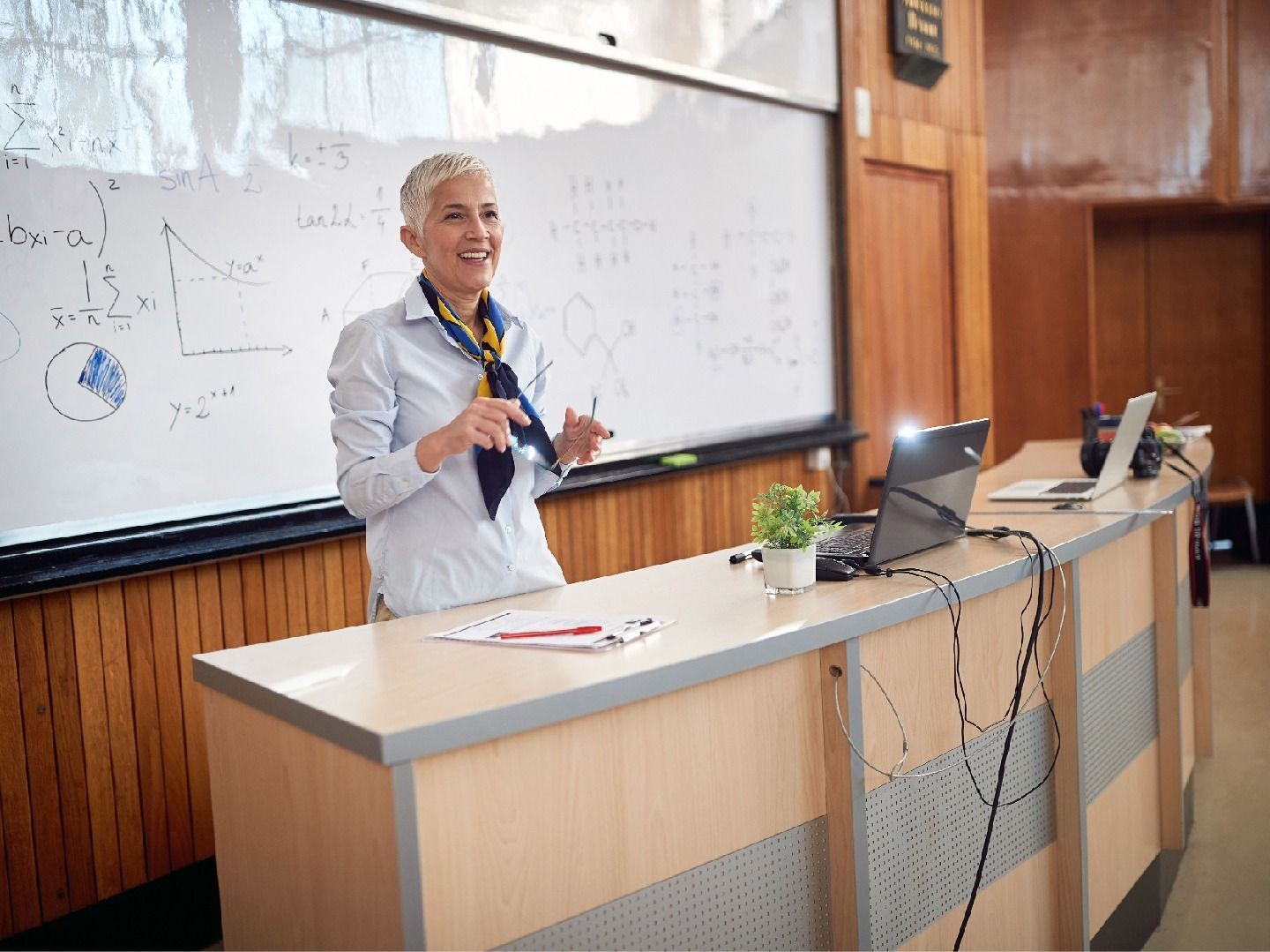 A professor in front of a lecture hall