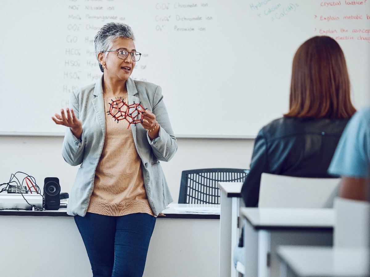 A teacher in front of a science classroom