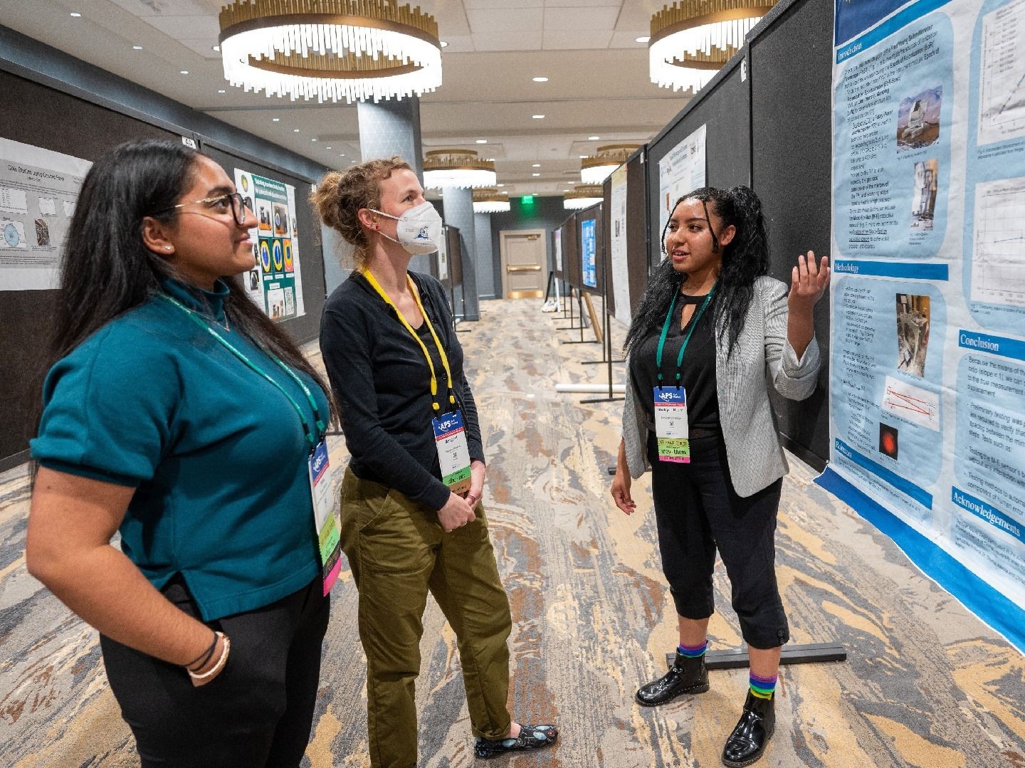 Students discussing a research poster