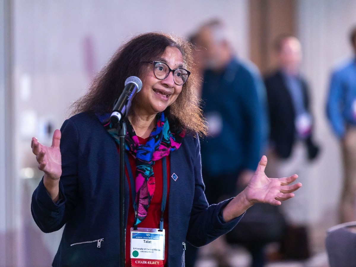 An attendee speaking at an APS meeting