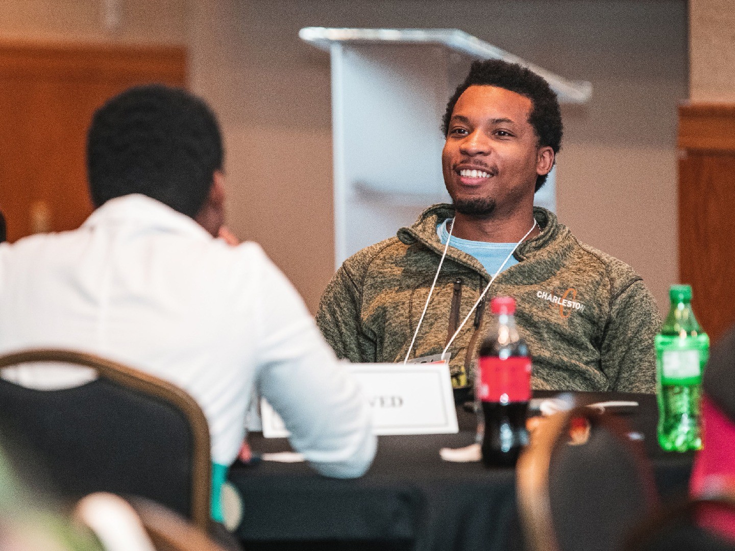 A student speaks with a scientist at APS March Meeting.