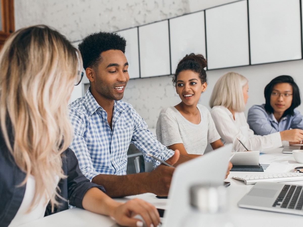 People at a meeting, sitting around a table