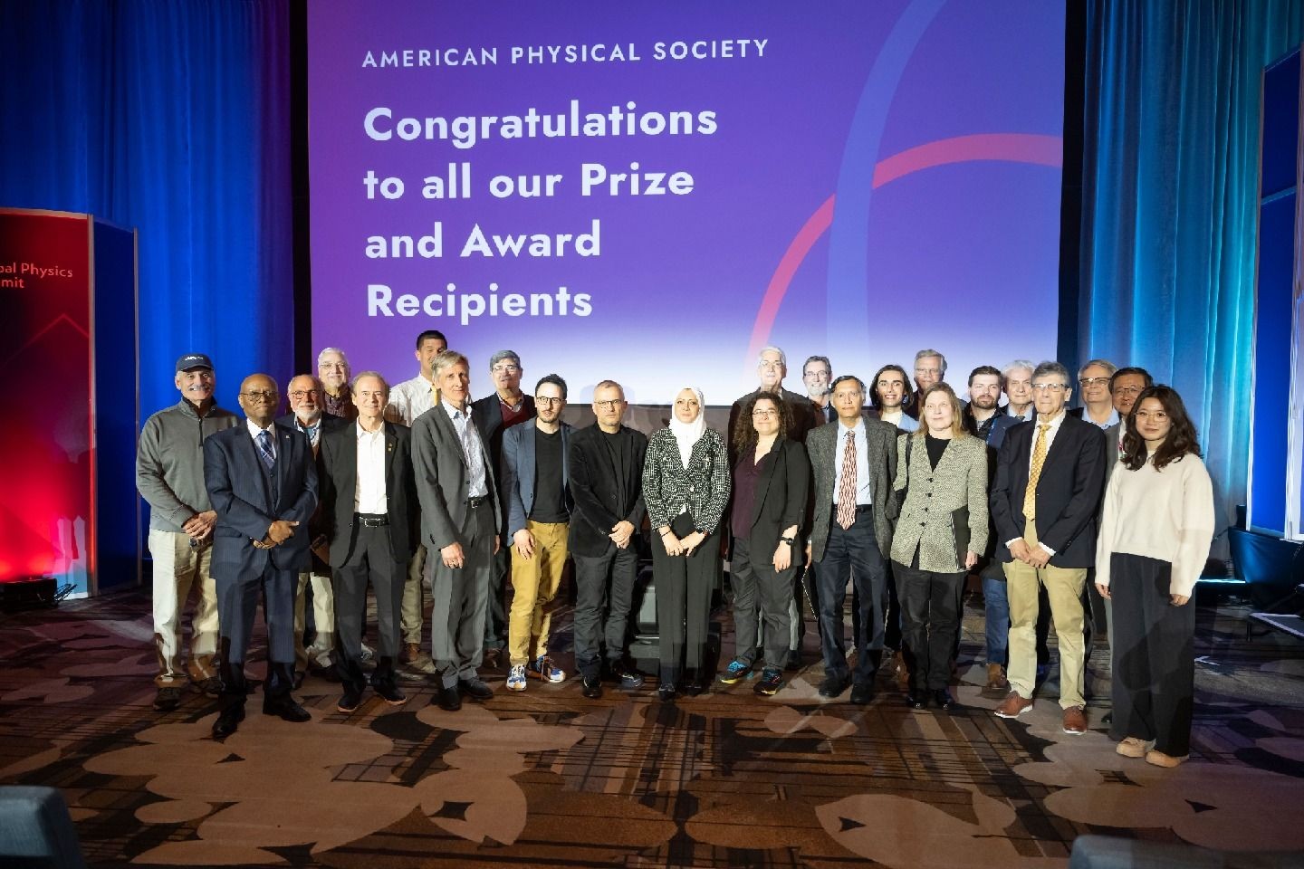 Recipients at the prize and award ceremony gather on stage