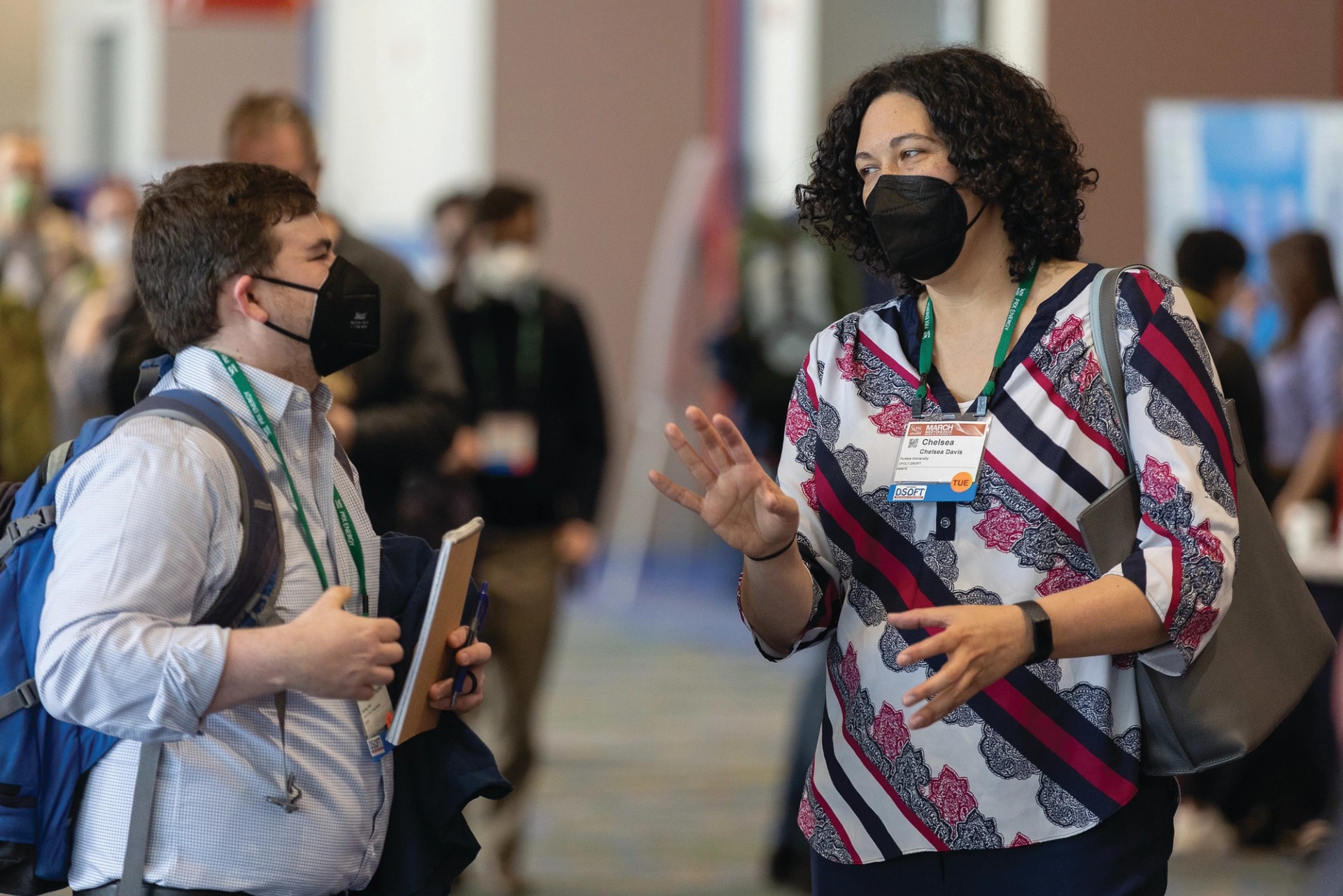 Two women networking at conference