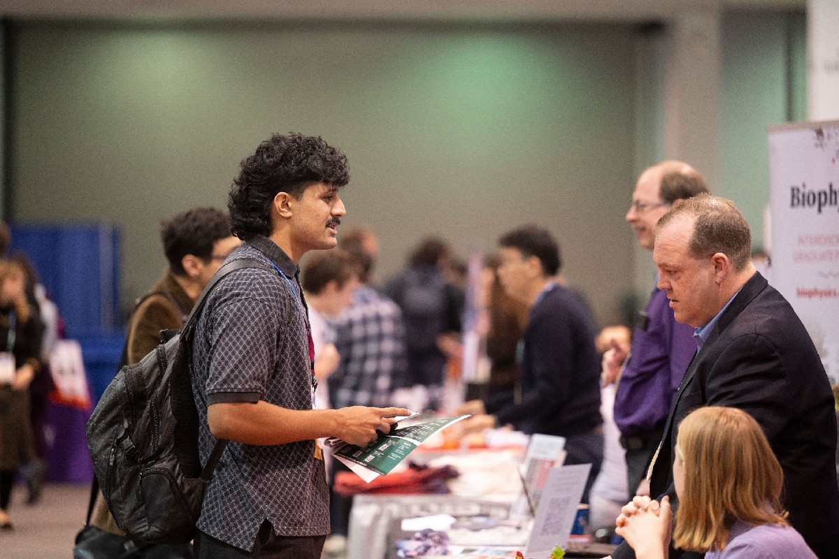 Meeting attendee asks questions at the Global Physics Summit