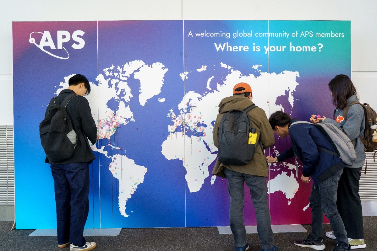 Students at the APS Global Physics Summit indicating where they are from on a world map