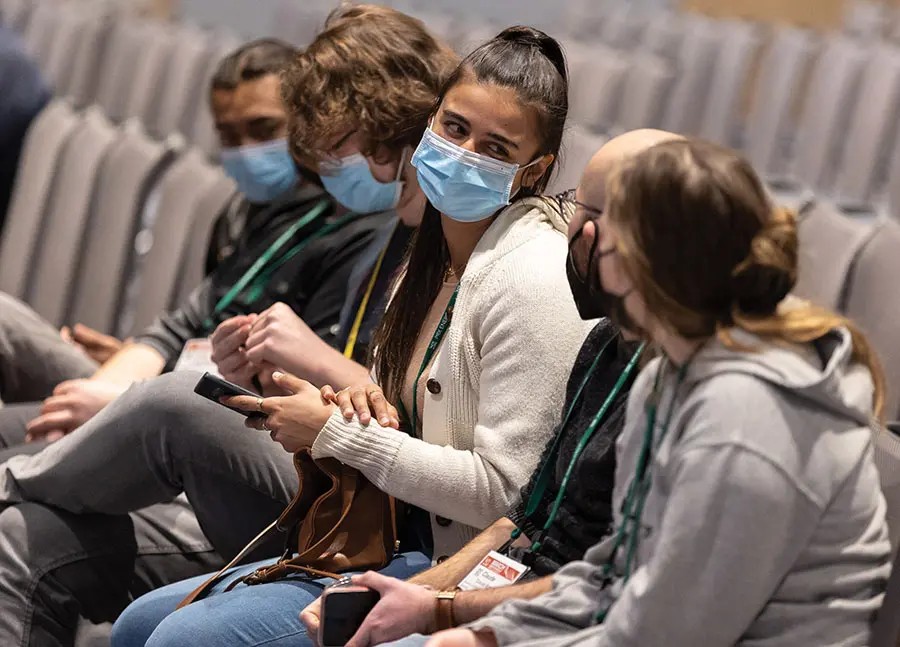 Attendees sitting in an auditorium