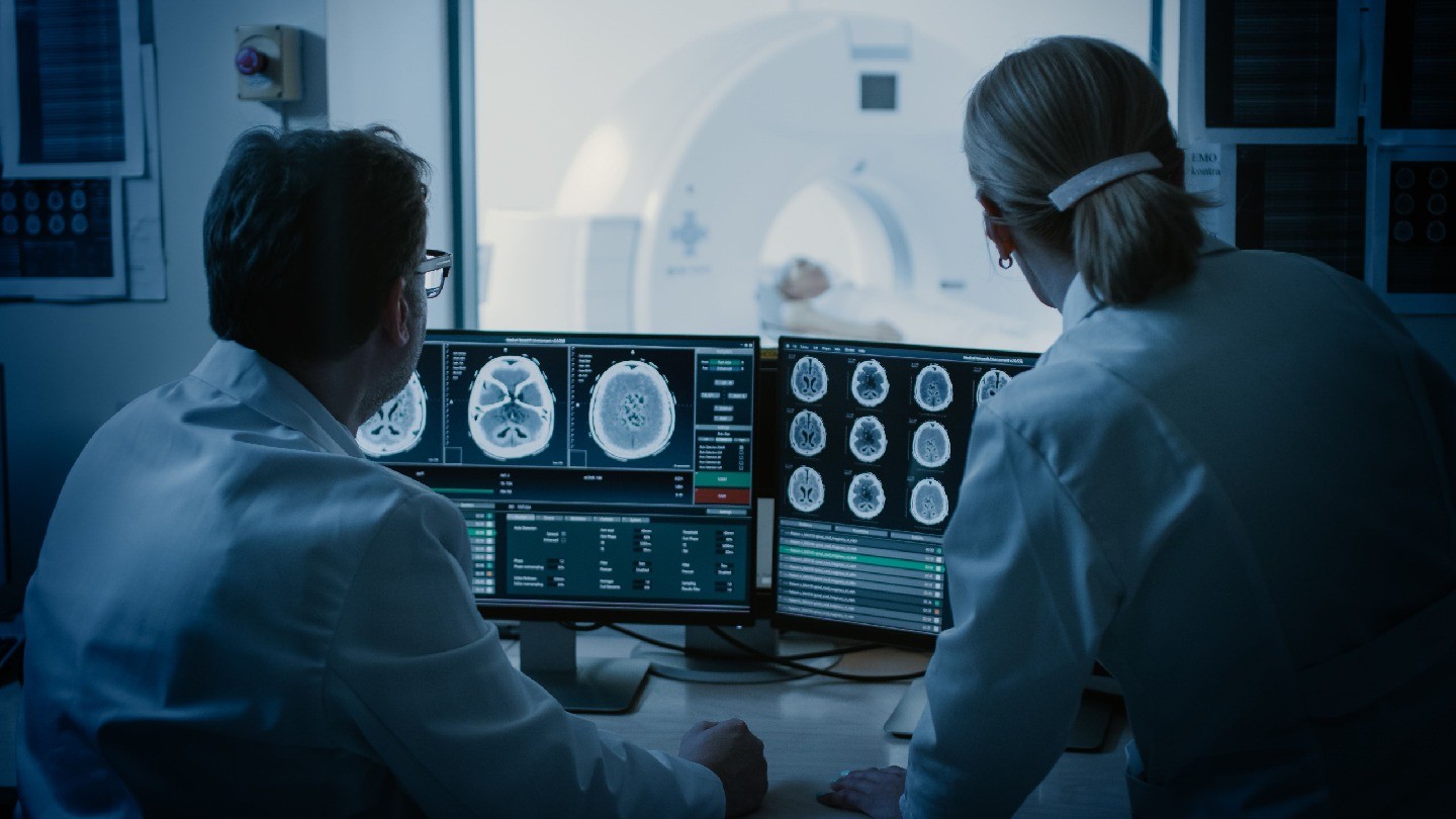 Two physicists with an MRI