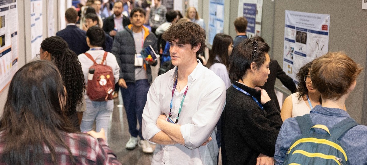 Scientists presenting posters at an APS meeting