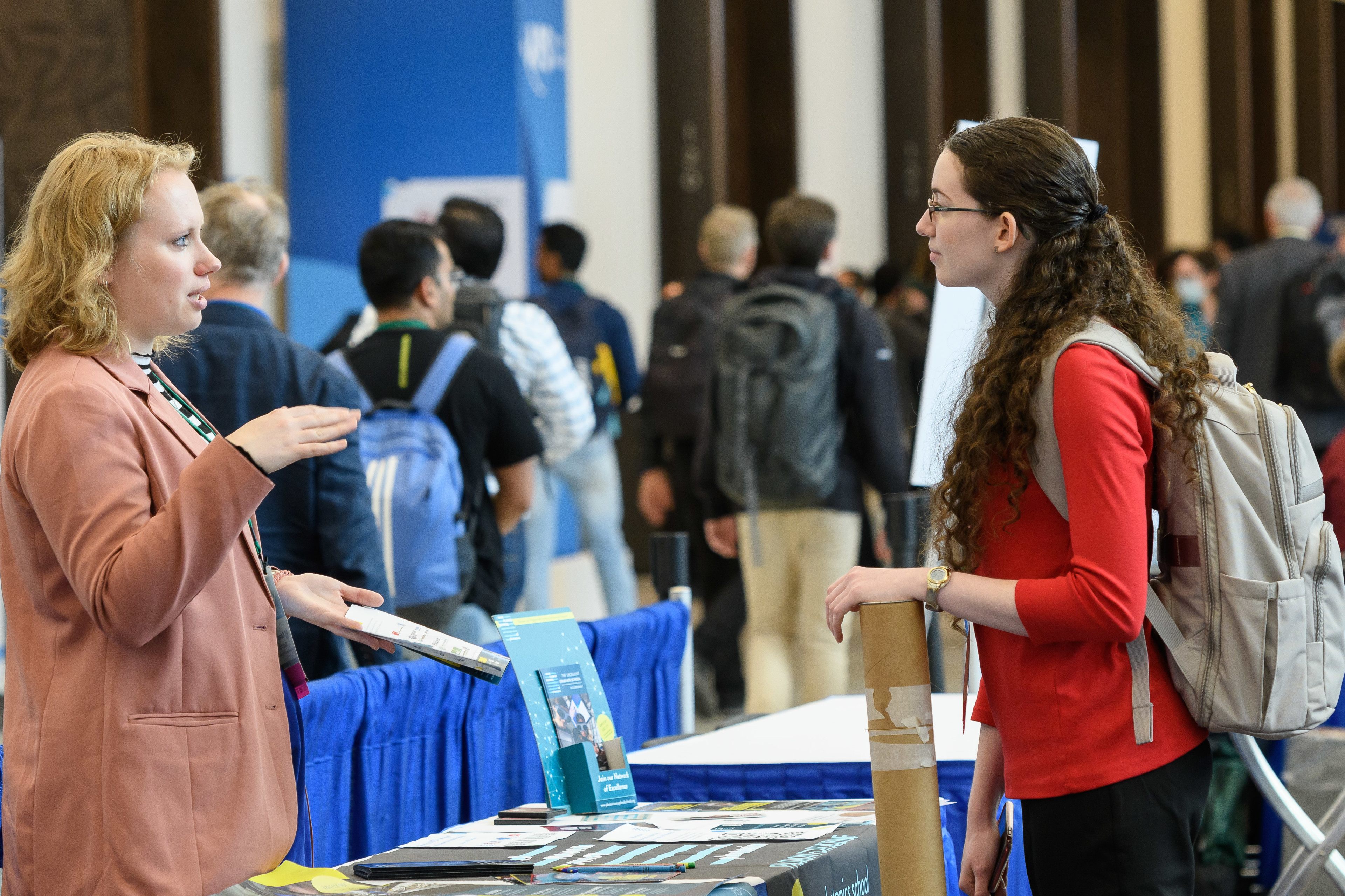 A student speaking with a graduate school representative at APS March Meeting 2023