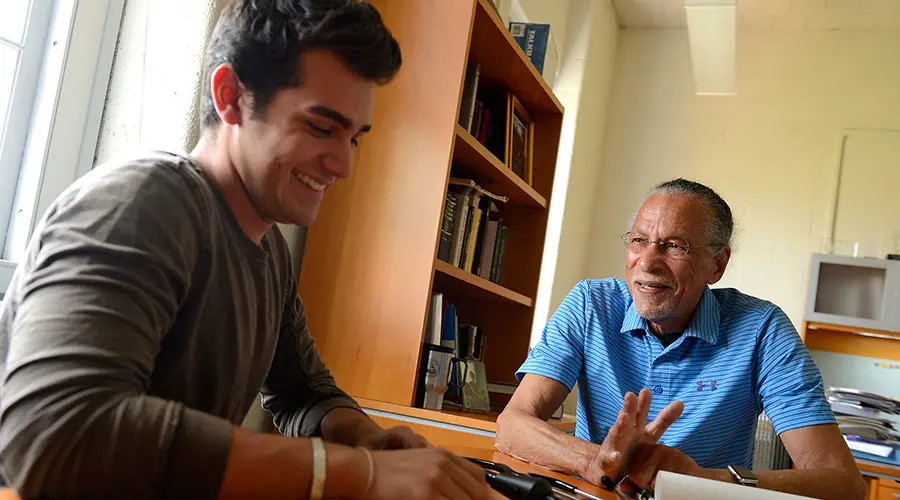James West speaks with a student.