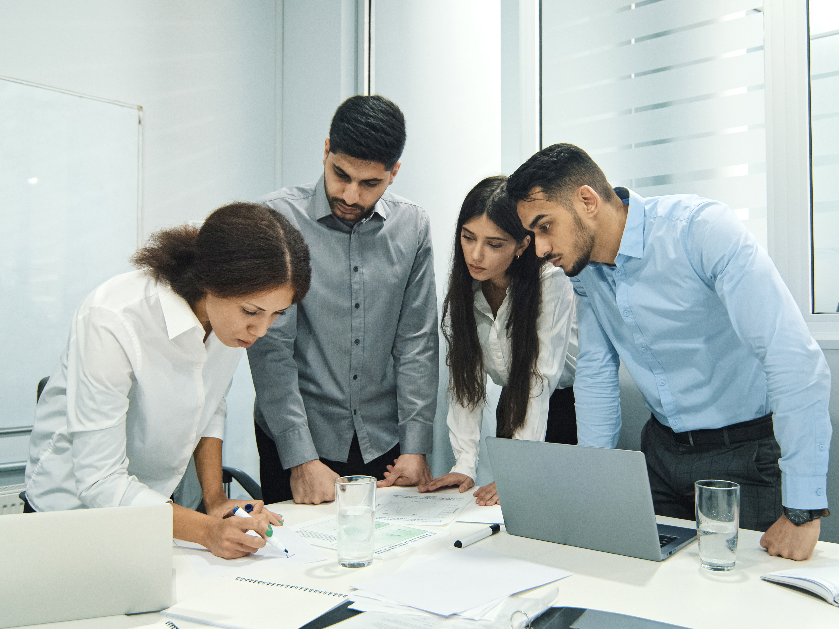 A group of climate analysts study data sheets